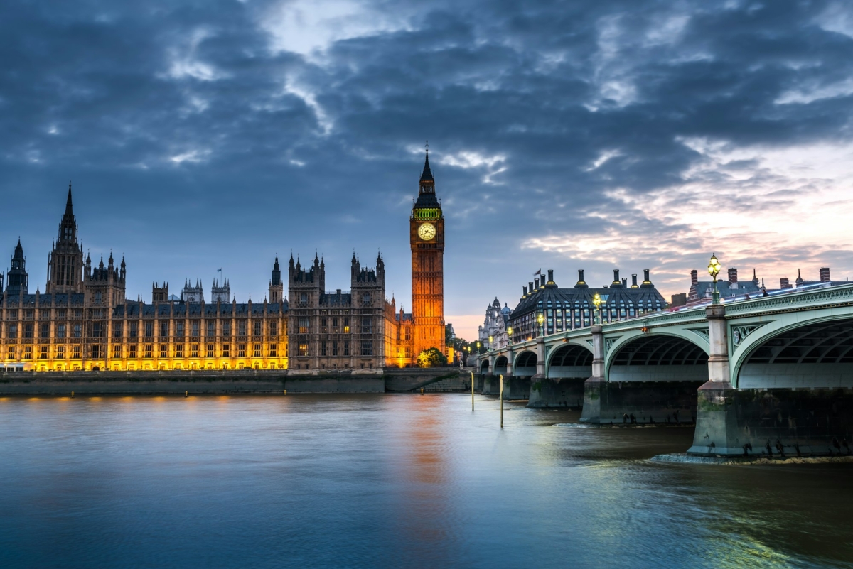 Westminster abbey and big ben in the London skyline at night, London, UK