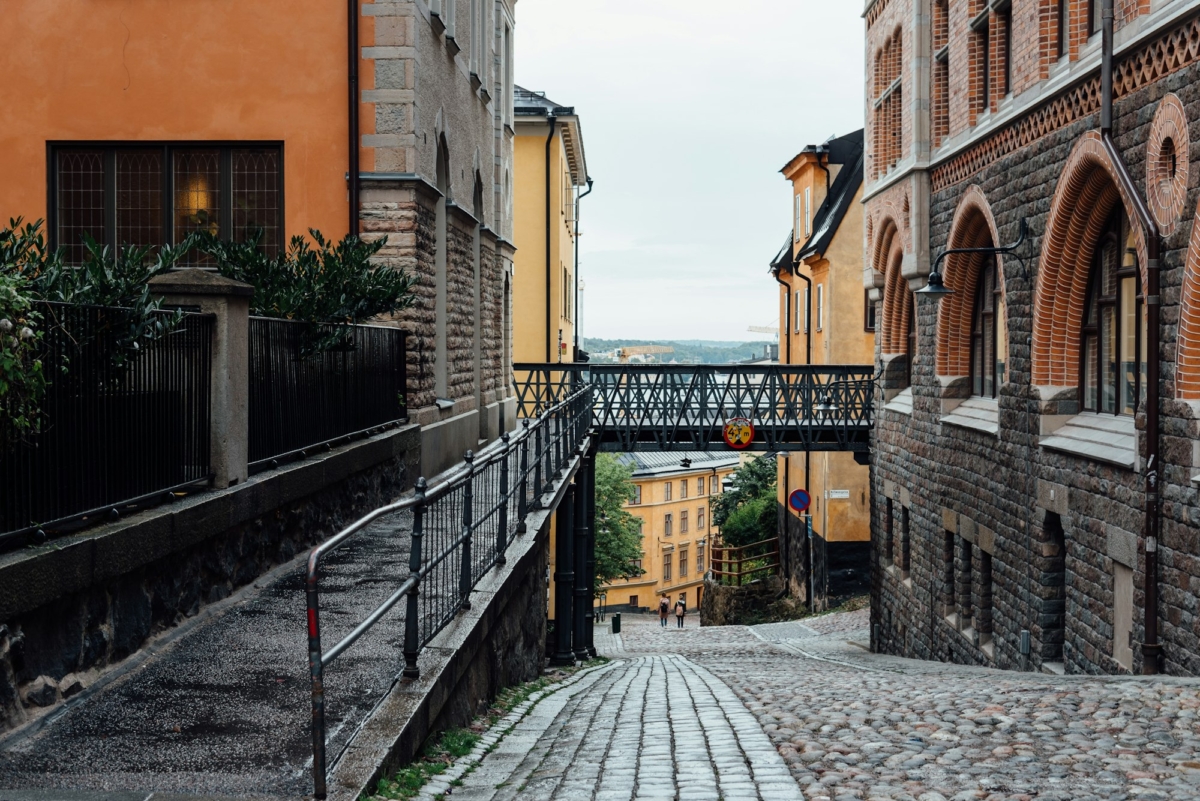 Picturesque cobblestoned street with colorful houses in Ugglan quarter in Sodermalm, Stockholm,