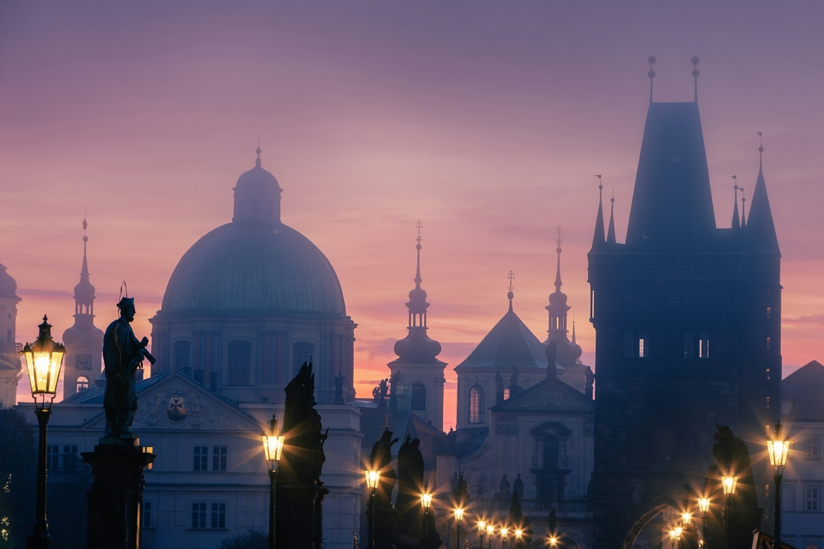 Colorful sunrise over towers of Prague