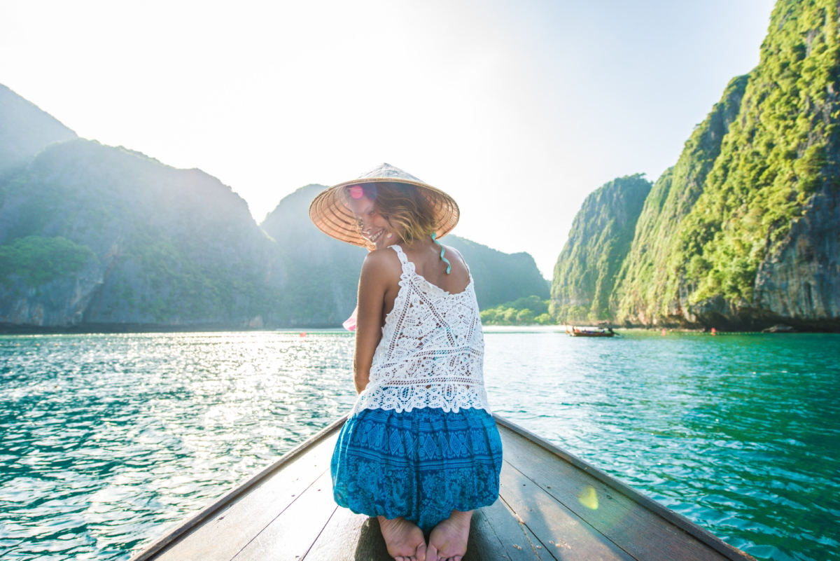 Beautiful woman on a long-tail boat in Thailand